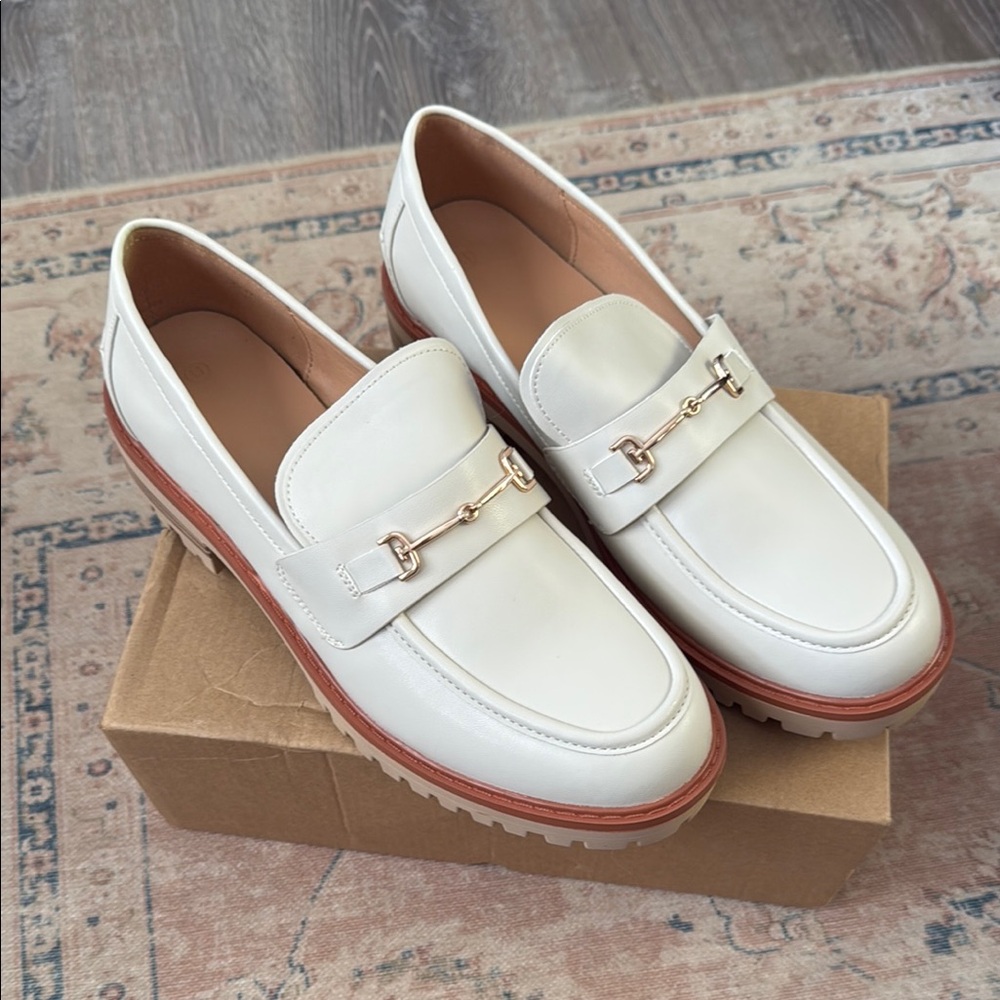 Stylish White Loafers with Gold Accent